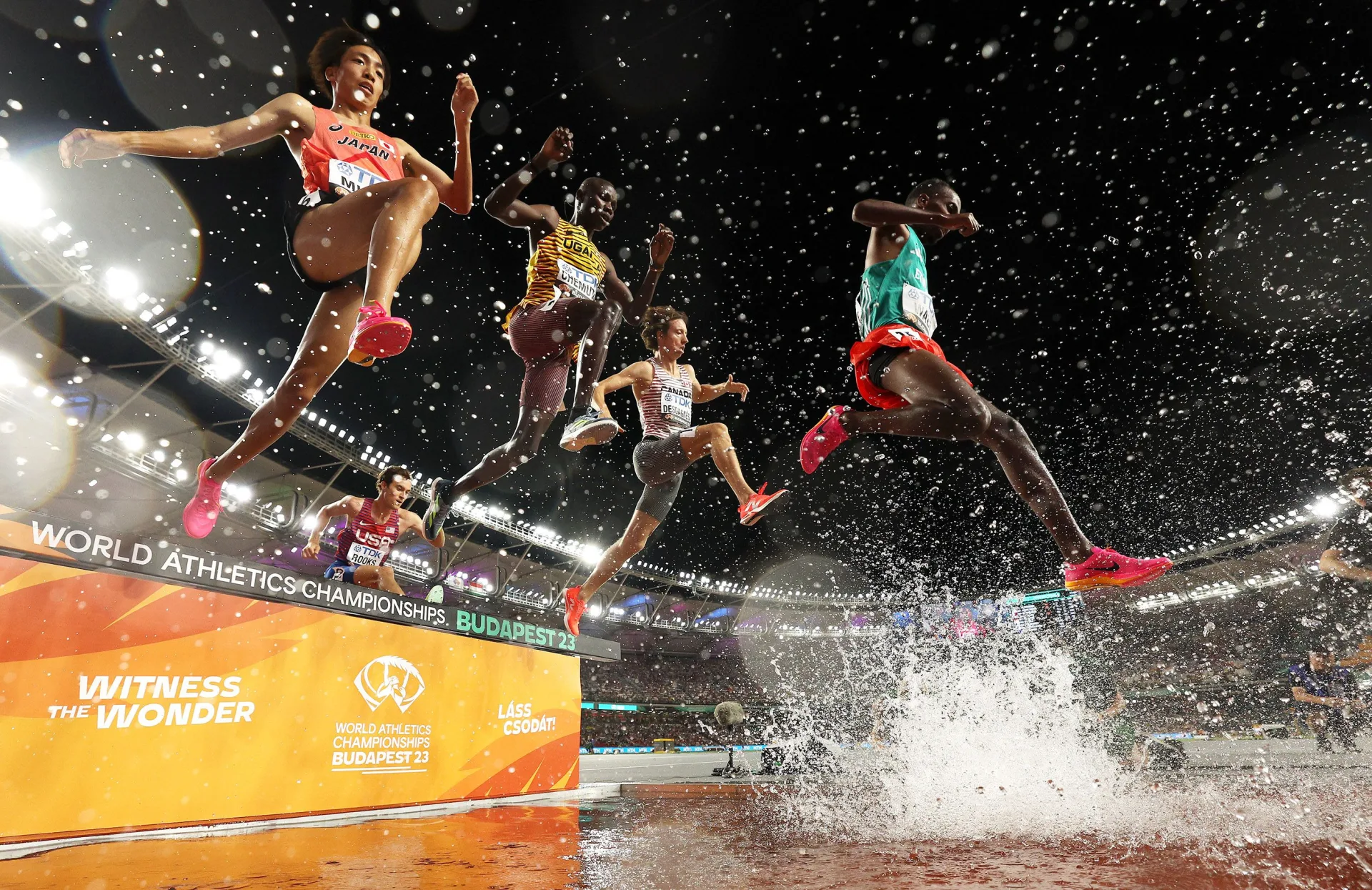 Athletes compete in men's steeplechase water jump during World Athletics Championships Budapest 2023