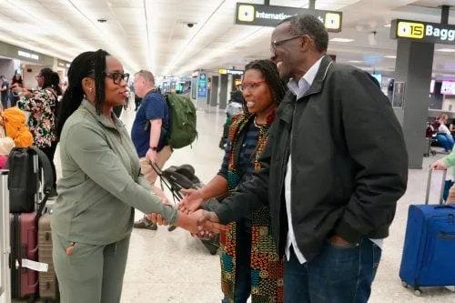 Former Chief Justice David Maraga shaking hands with supporters after landing at an international airport in the US on Sept 17, 2026