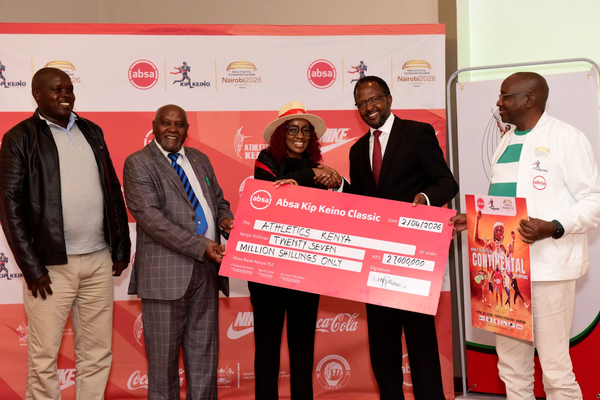 Absa Bank Kenya Marketing and Corporate Affairs Director Mwihaki Wachira (Centre) presents the sponsorship cheque for the Absa Kip Keino Classic 2026 to Athletics Kenya Competition Director Kennedy Tanui,  Vice President Jinaro Kibet (2nd Right), Competition Director Kennedy Tanui, Senior Vice Presi