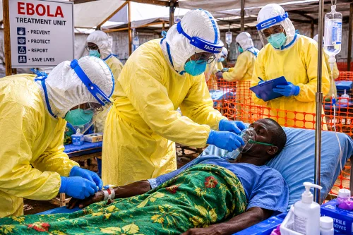 Health professionals testing ebola virus on one patient.