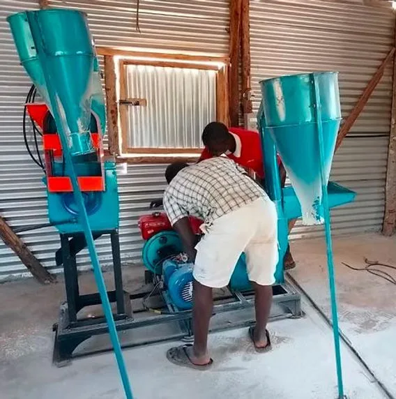 A man in a posho mill